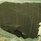 Illustration for article titled New video of mysterious giant Siberian hole filmed by investigation team